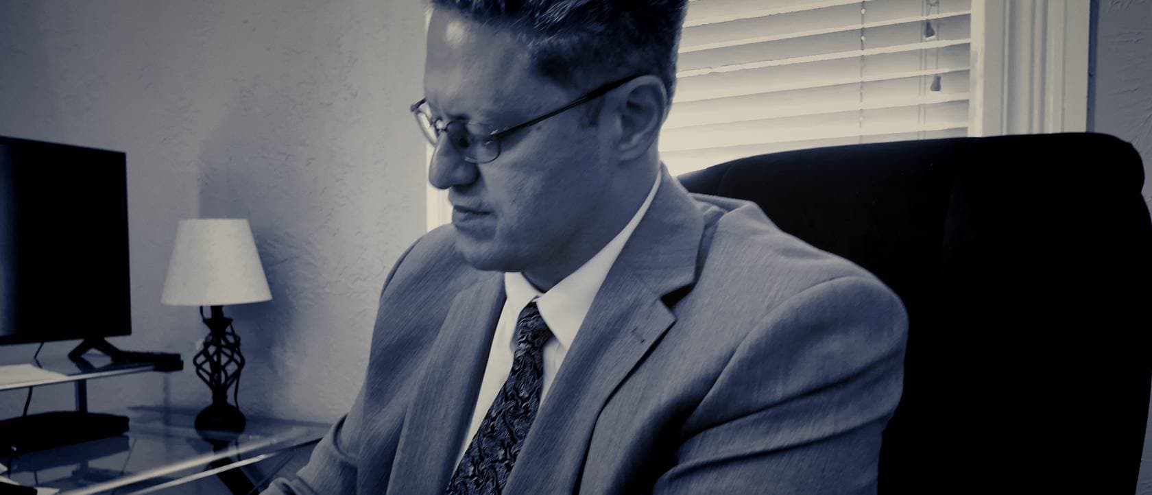 Case notes being written at the El Paso office, graded still from firm footage